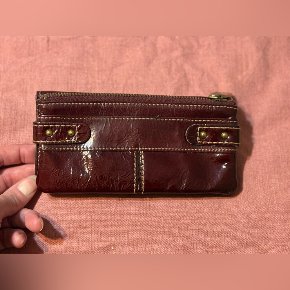 Fossil Reddish Brown Patent Leather Wallet with Brass Accents